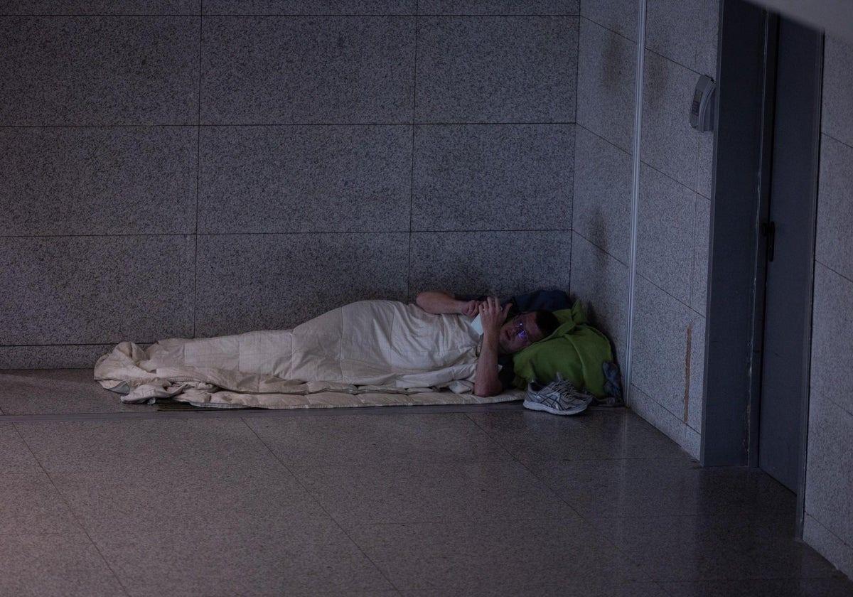 A homeless person in a corner of T3 at Malaga airport.